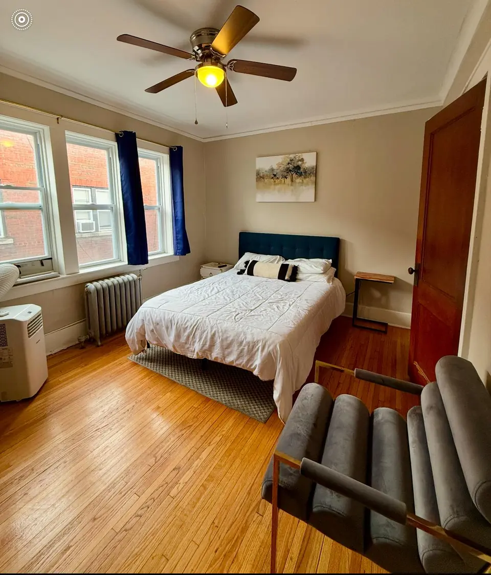 Studio sleeping area with ceiling fan